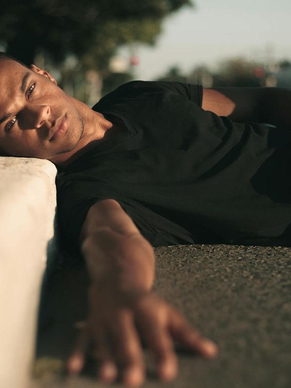 Person stretching peacefully in a calm, modern environment.