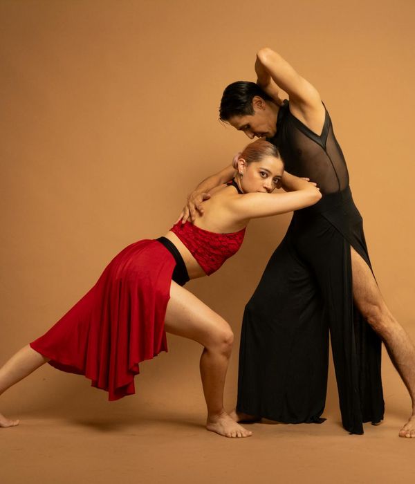 Woman in a dynamic yoga pose demonstrating fluidity and balance.